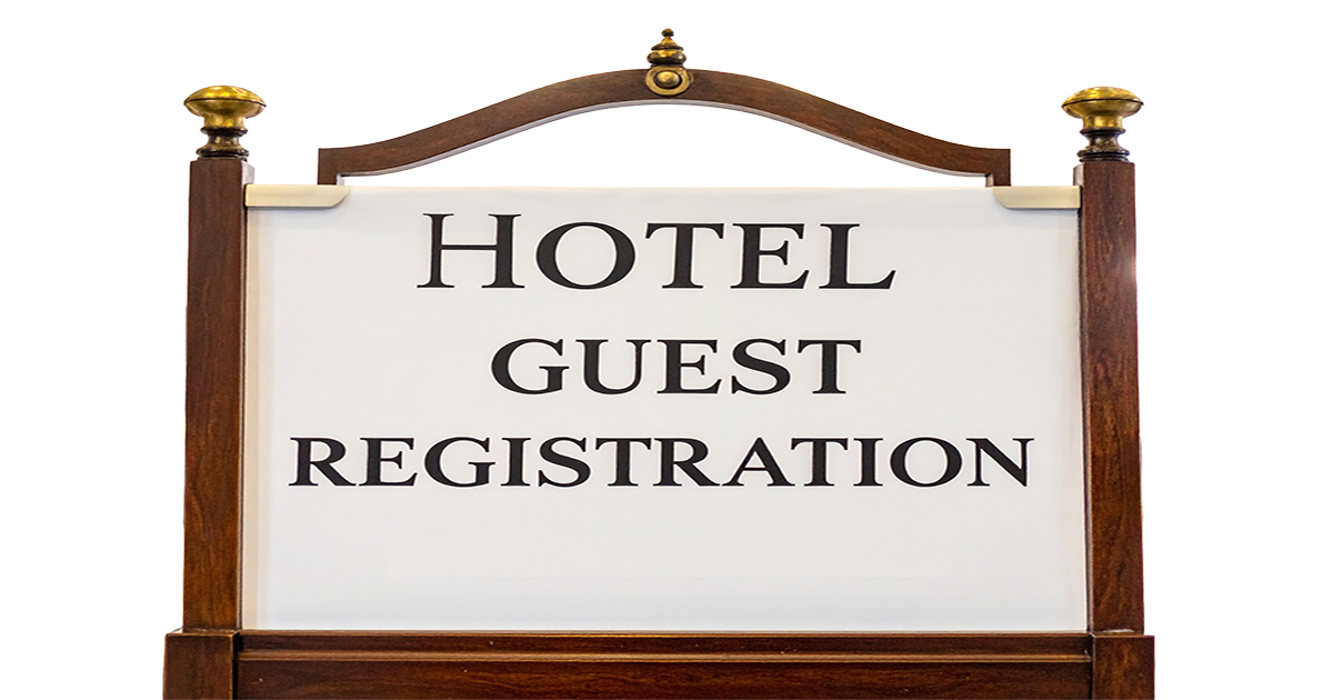 photo of a sign reading hotel guest registration